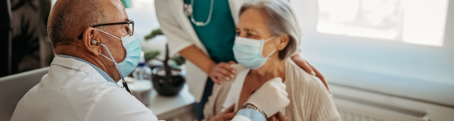 Shot of a doctor checking senior patient 